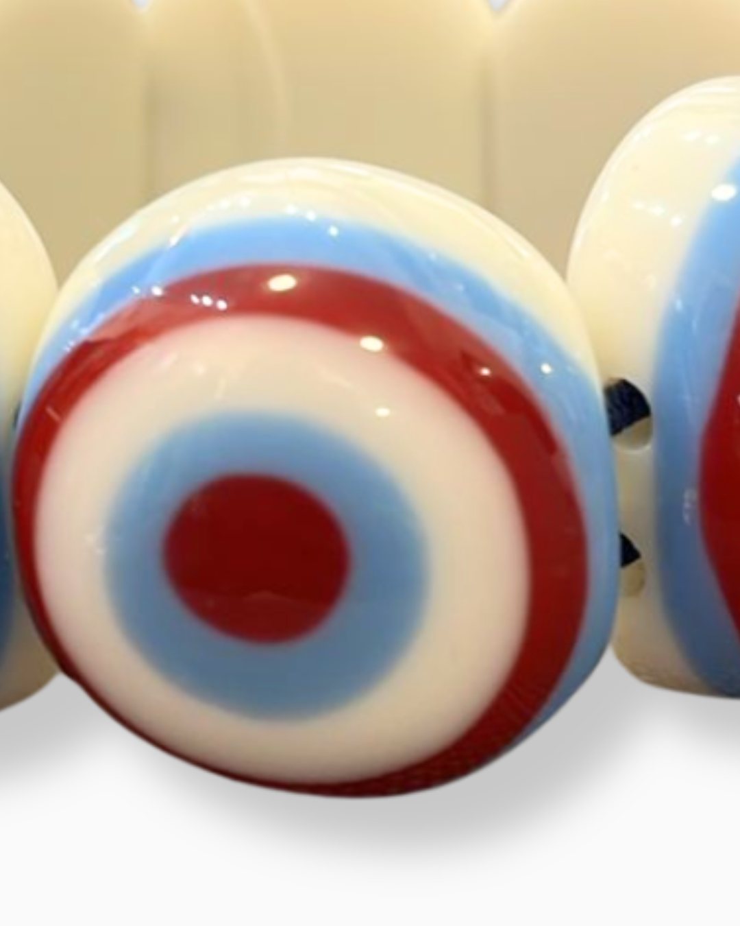 PULSERA RESINA HIBISCO OJO BURDEO/CELESTE